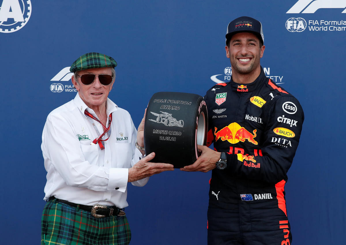 Red Bull’s Daniel Ricciardo celebrates qualifying in pole position with F1 legend Jackie Stewart on Saturday. REUTERS