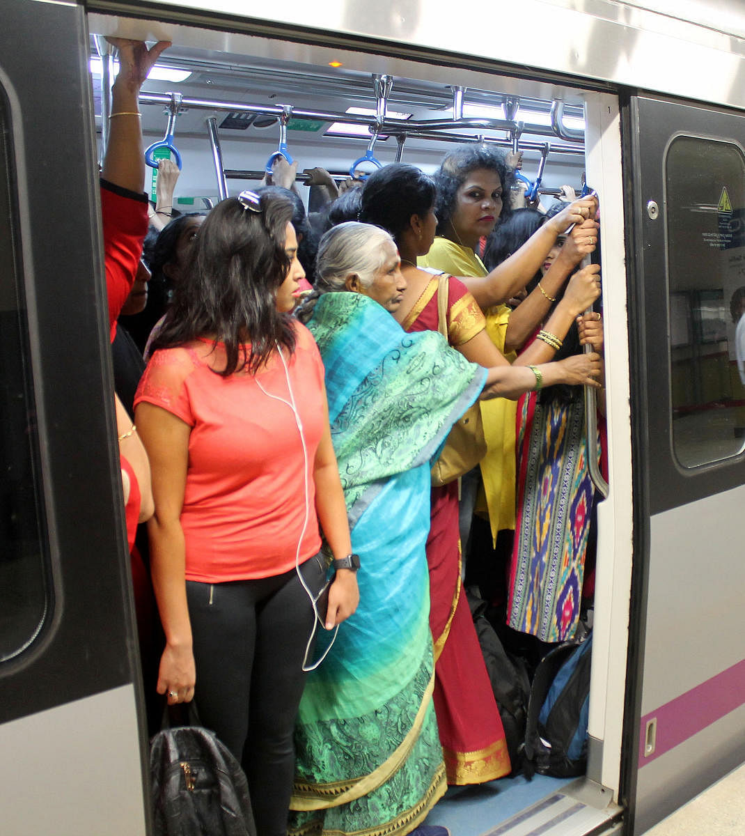 Increased ridership has created huge rush in the three-car metro trains. The wait for six-car trains continues.