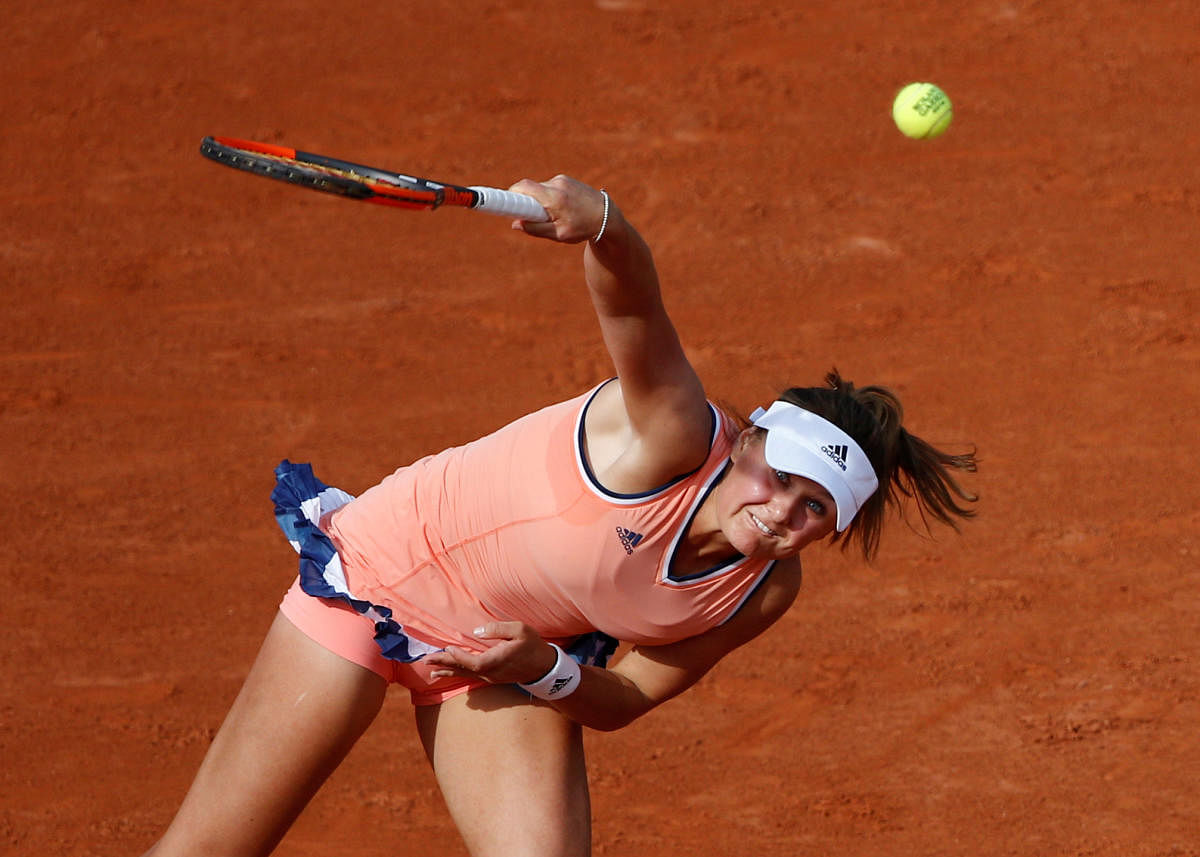 Ukraine's Kateryna Kozlova serves during her first round match against Latvia's Jelena Ostapenko. REUTERS