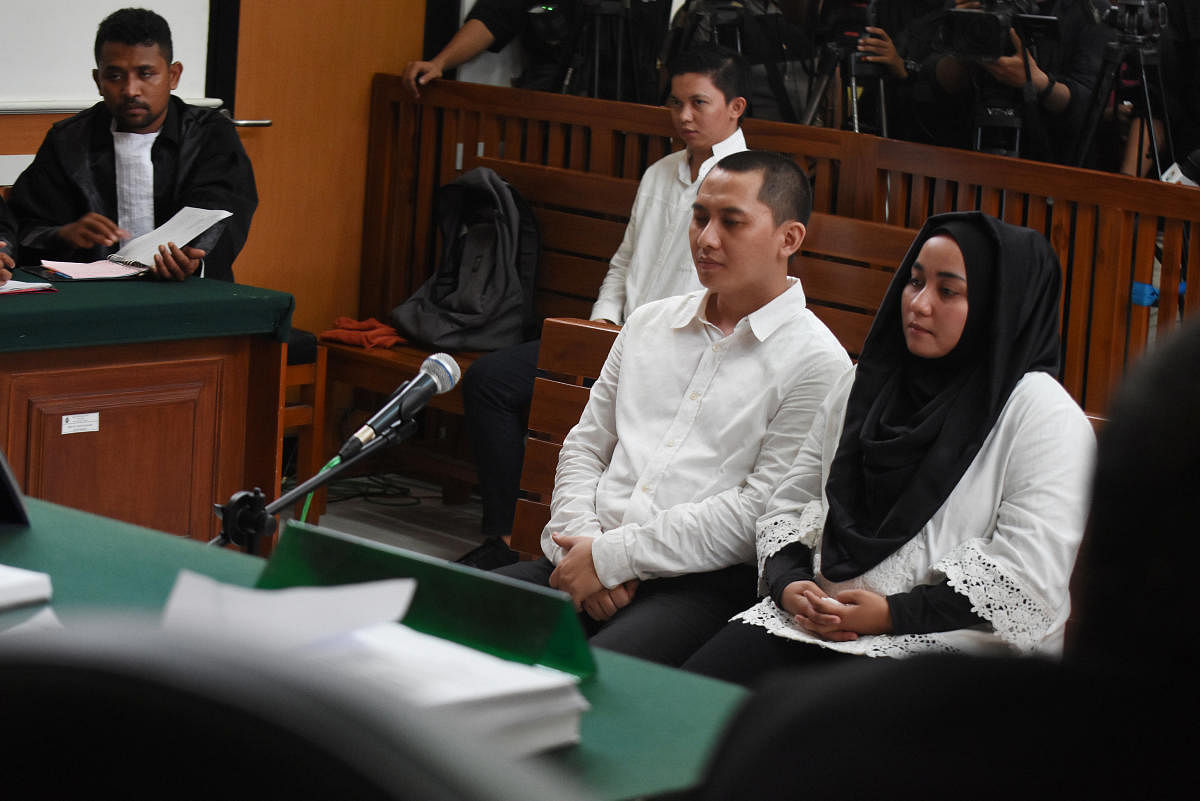 Anniesa Hasibuan and her husband Andika Surachman sit during their trial at the Depok district court in Jakarta on May 30, 2018. Reuters