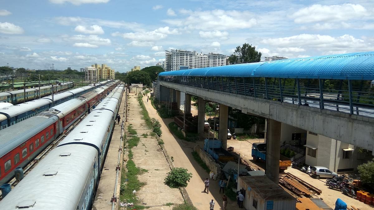 The walkway bridge connecting City Railway Metro Station with Krantiveera Sangolli Rayanna Railway Station has been provided with shelter with the remaining civil work expected to be completed in a month. DH Phot