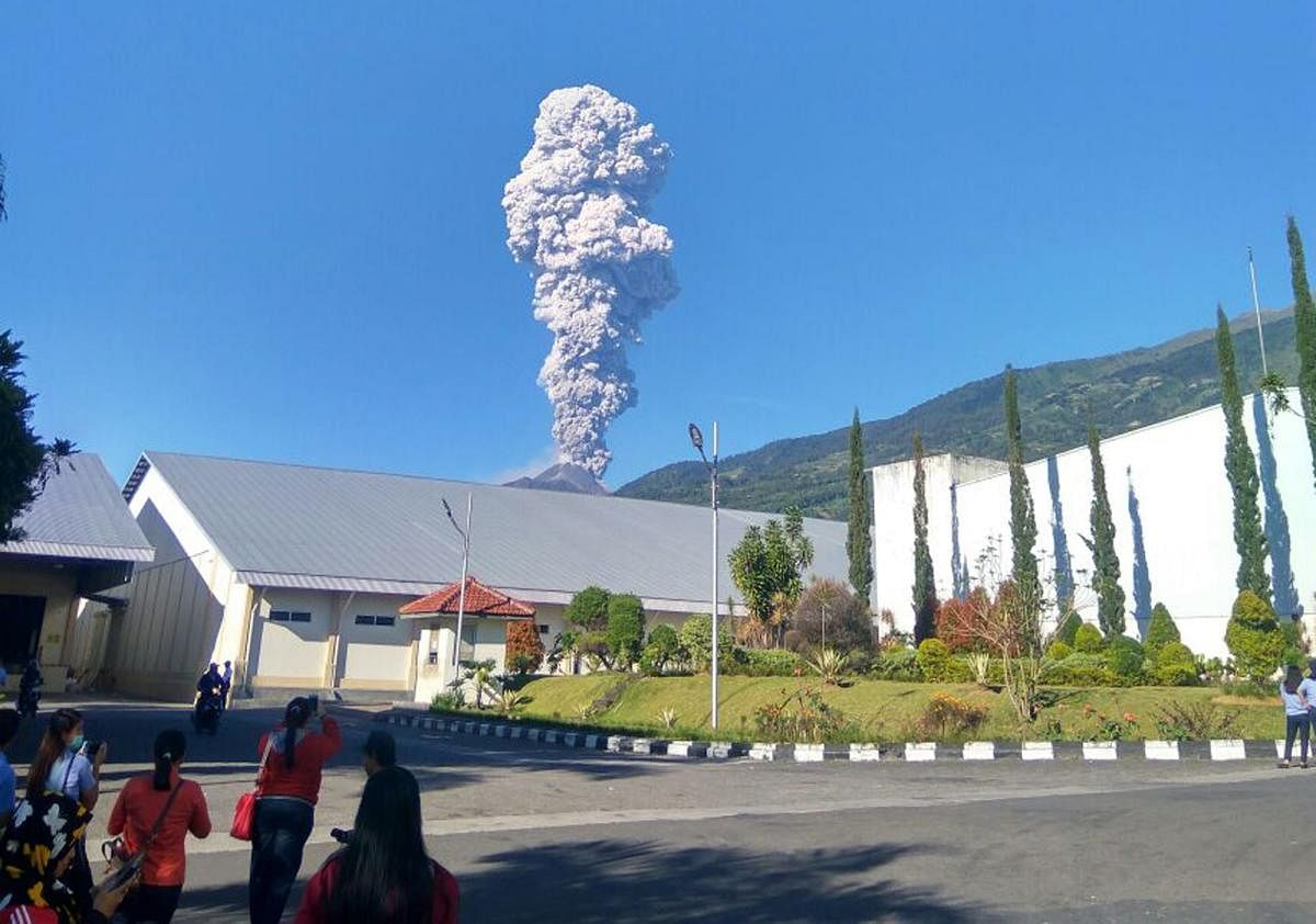 Mount Merapi spews volcanic materials from its crater as seen from Klaten, Central Java, Indonesia, Friday, May 11, 2018. Indonesia's most active volcano, Mount Merapi, has erupted, sending a column of volcanic materials as high as 5,500 meters (18,045 fe