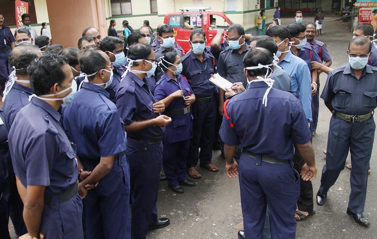 Security staff being given instructions by the head after the outbreak of Nipah virus at Medical College in Kozhikode. PTI file photo