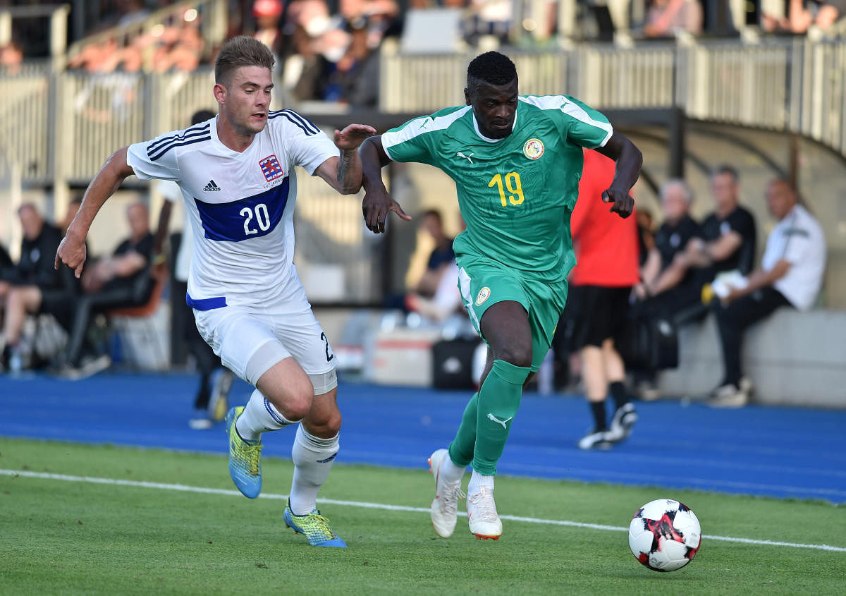 Senegal's M'Baye Niang (left) and Luxembourg's David Turpel vie for the ball during their international friendly match on Thursday. REUTERS