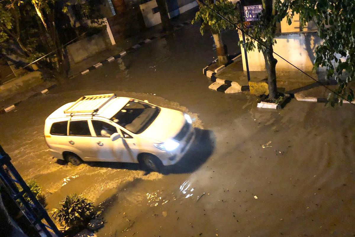 A waterlogged road in Koramangala after rain on Friday evening.