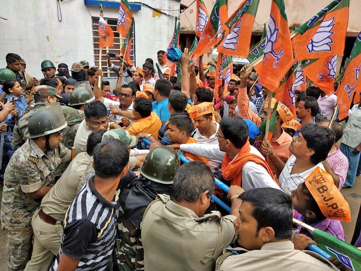 BJP leaders and activists raise slogans during a protest against the alleged unconstitutional situations throughout West Bengal, in front of Katwa Police station in Purba Bardhaman district on Friday, June 01, 2018. PTI Photo