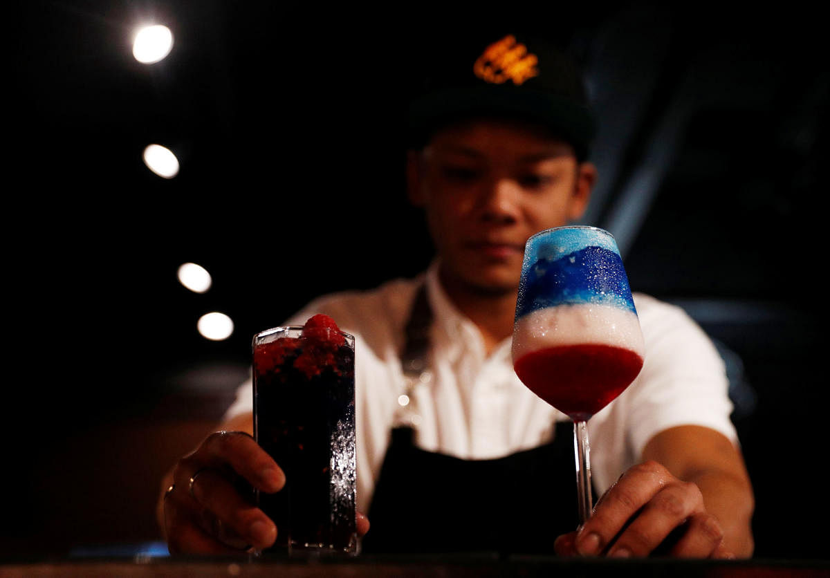Cocktails "Kim" and "Trump", special drinks offered at Escobar bar to mark the summit meeting between US President Donald Trump and North Korean leader Kim Jong-un, are prepared by a bartender in Singapore June 4, 2018. Reuters