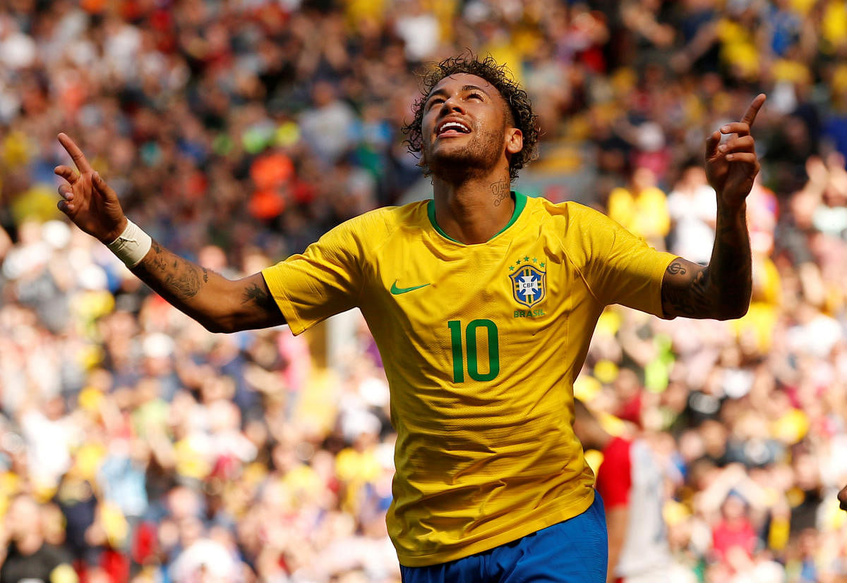 Brazil's Neymar celebrates scoring their first goal against Croatia on Sunday. REUTERS