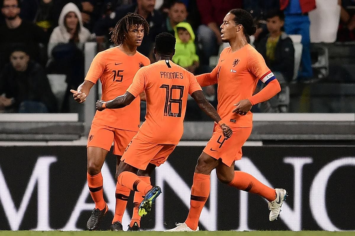 The Netherlands Nathan Ake (left) celebrates with team-mates after scoring against Italy during their international friendly match on Monday. AFP