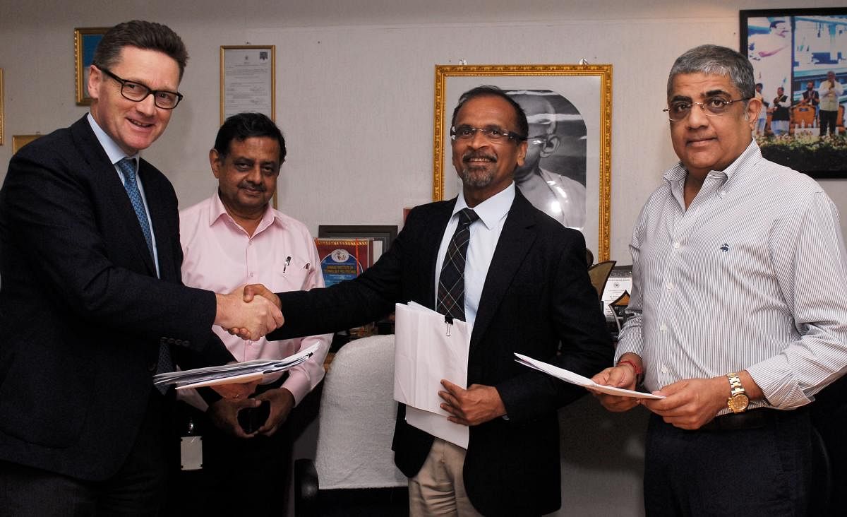 Mike Holland, CEO, Embassy Office Parks, with BMRCL managing director Mahendra Jain on Tuesday.