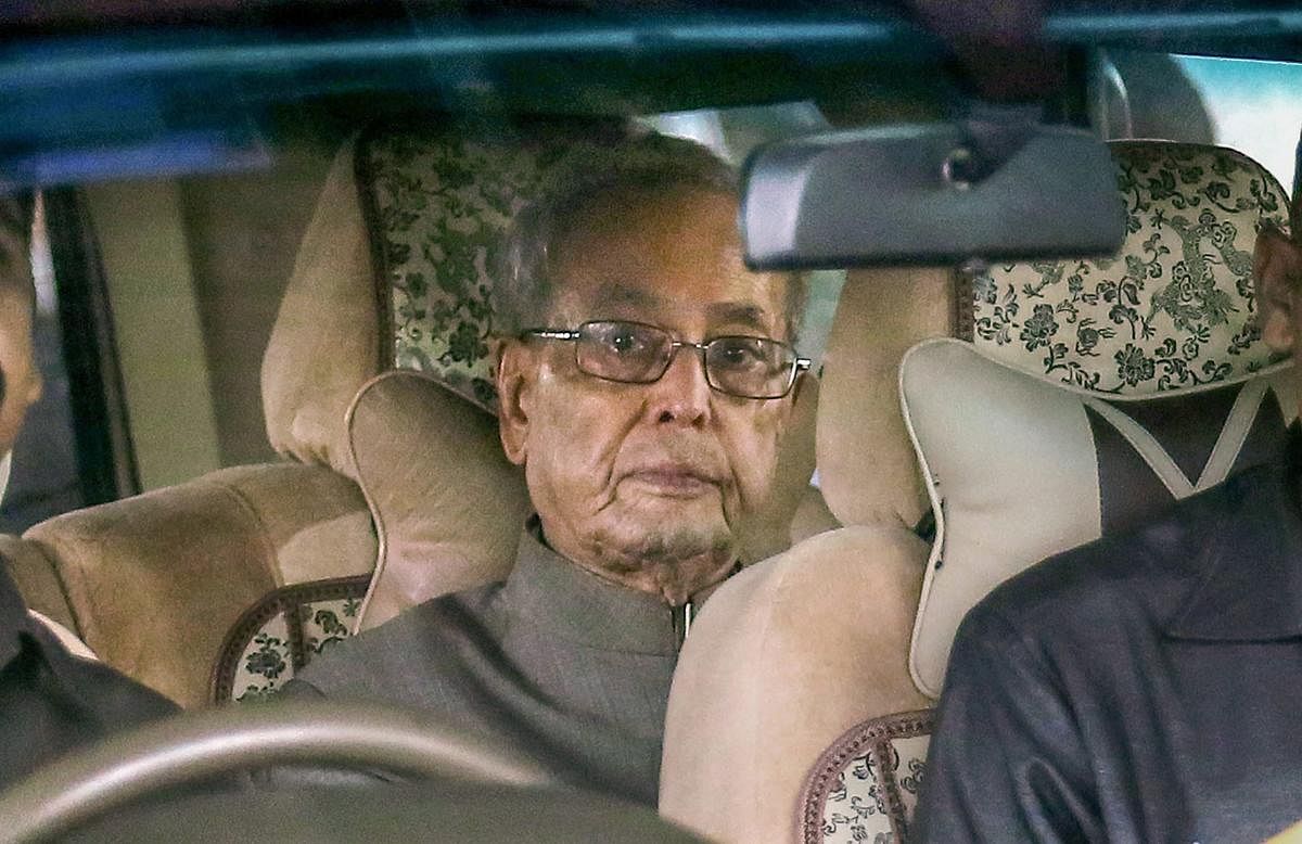 Former president Pranab Mukherjee arrives at Nagpur Airport, in Maharashtra on Wednesday. Mukherjee arrived to attend an RSS event on Thursday which has generated a lot of interest and controversy over the last few days. PTI Photo