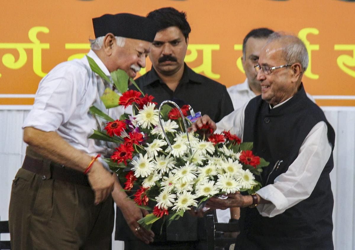 Former president Pranab Mukherjee being welcomed by RSS chief Mohan Bhagwat at the closing ceremony of Tritiya Varsha Sangh Shiksha Varg, an event to mark the conclusion of a three-year training camp for swayamsevaks, in Nagpur, on Thursday. PTI