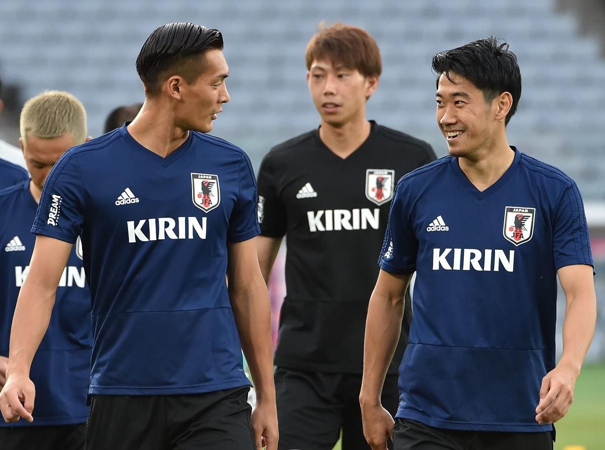 Shinji Kagawa (right), who has rediscovered his form of old, will be the man Japan will be pinning most of their hopes on at the World Cup. AFP