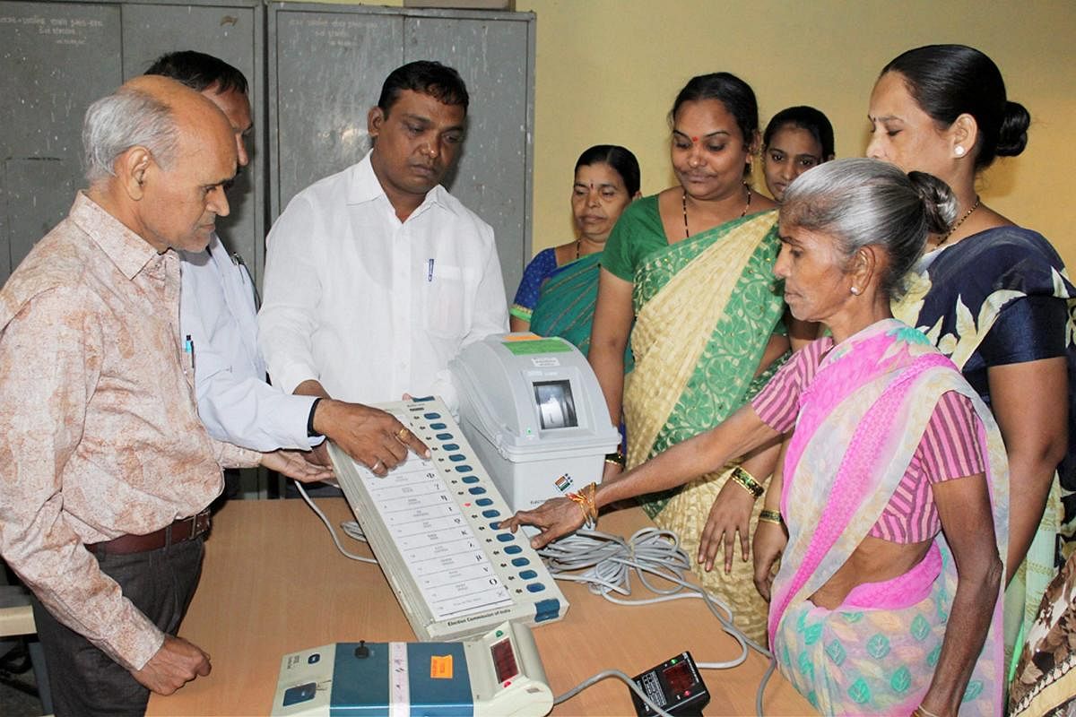 Election officials demonstrate VVPAT machines at a centre. PTI/FILE