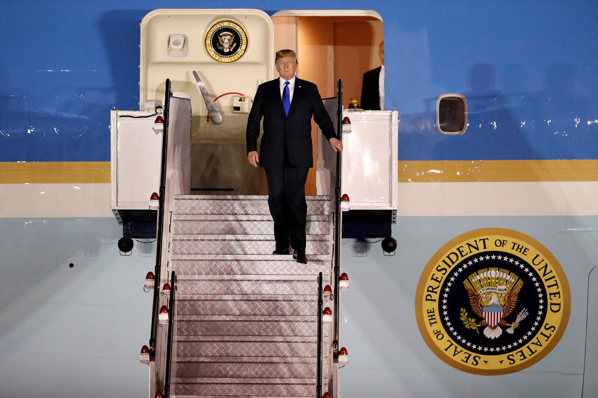 U.S. President Donald Trump steps off his plane as he arrives at Paya Lebar Air Base in Singapore, ahead of a summit with North Korean leader Kim Jong Un, June 10, 2018. Reuters.