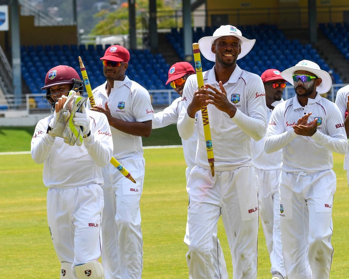 Jubilant: West Indies players celebrate after beating Sri Lanka in the first Test on Sunday. AFP