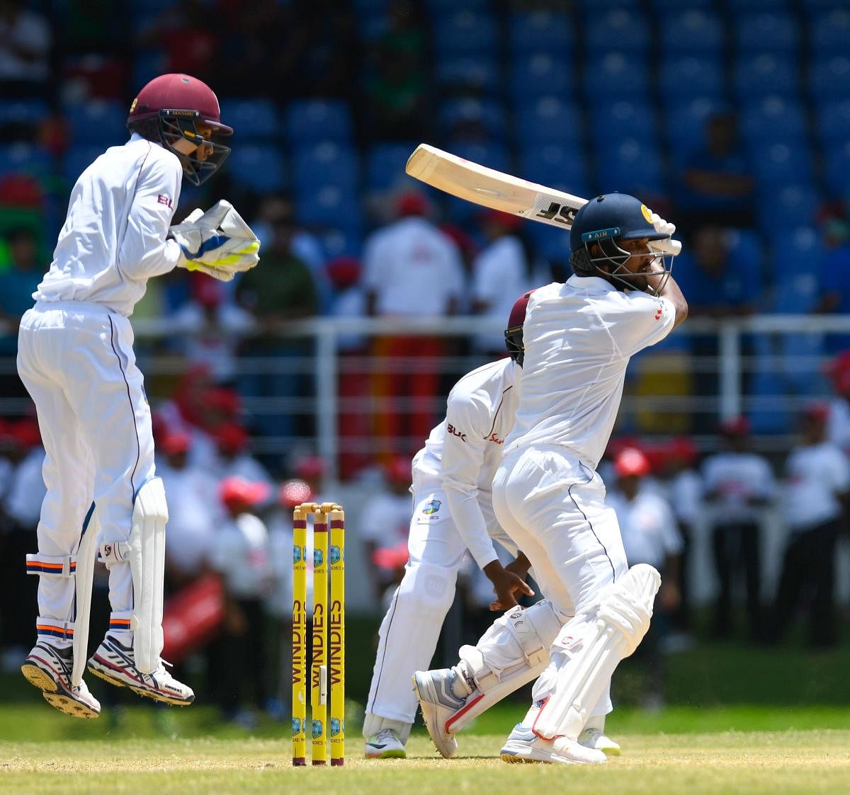 Dinesh Chandimal cuts one to the fence en route his unbeaten 119 against West Indies. AFP