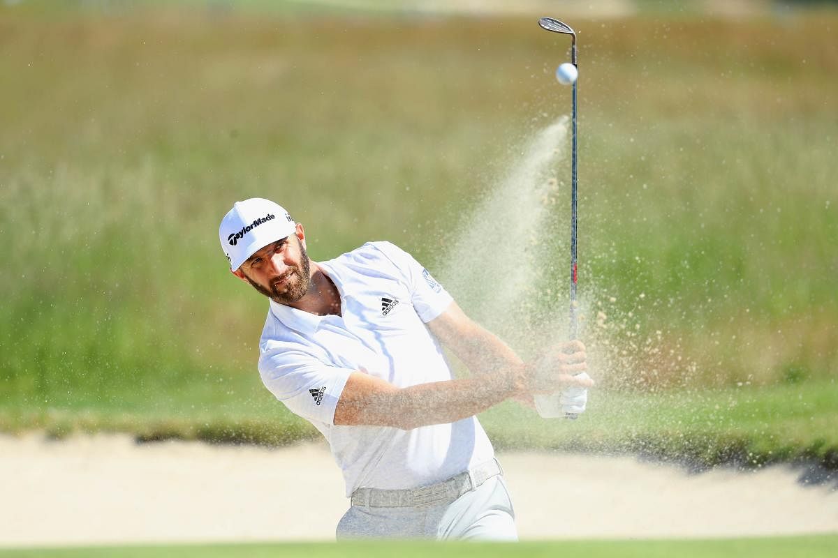 STEADY SAILING Dustin Johnson chips out of a bunker during the opening round of the US Open on Thursday. AFP