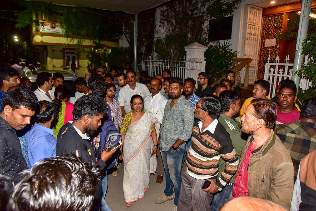 The supporters of Mohammed Nalapad gather in front of his house at Shantinagar. DH Photo/B H Shivakumar