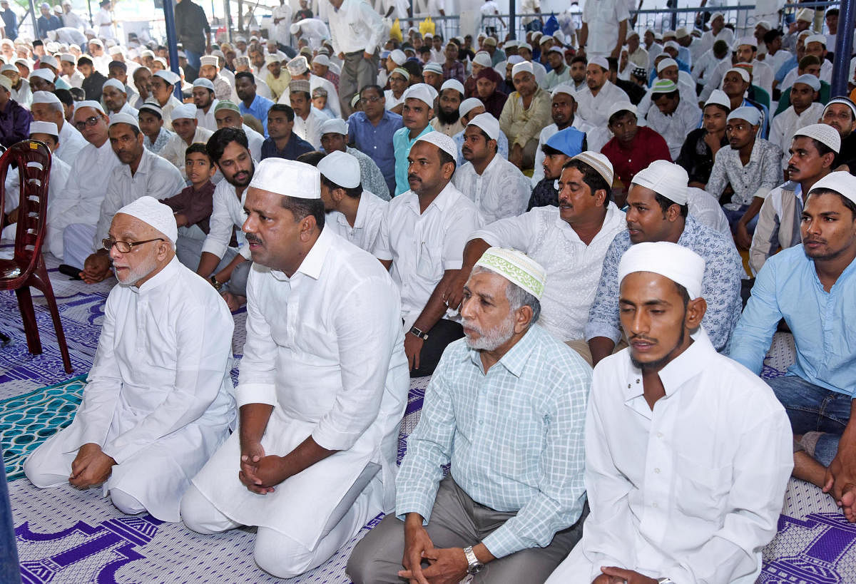 District In-charge Minister U T Khader offers prayer on account of Eid-ul-Fitr, at the Idgah Masjid on Light House Hill of Mangaluru on Friday.