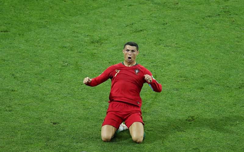 Ronaldo had twice put Portugal in front, and yet he was required to score a superb 88th-minute free-kick to grab a point after Spain had fought back brilliantly. (Reuters)