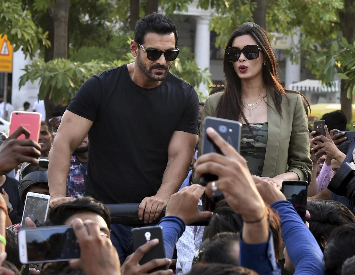 Bollywood actors John Abraham and Diana Penty during the film promotion of 'Parmanu: The Story of Pokhran', at Connaught Place, in New Delhi, on Tuesday. PTI Photo