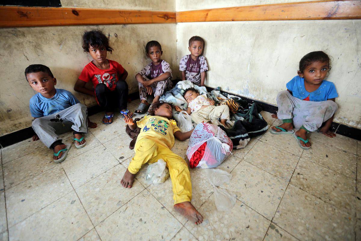 Children sit in a classroom of a school to which they have been evacuated from a village near Hodeidah airport amid fighting between government forces and Houthi fighters in Hodeidah, Yemen. (Reuters Photo)