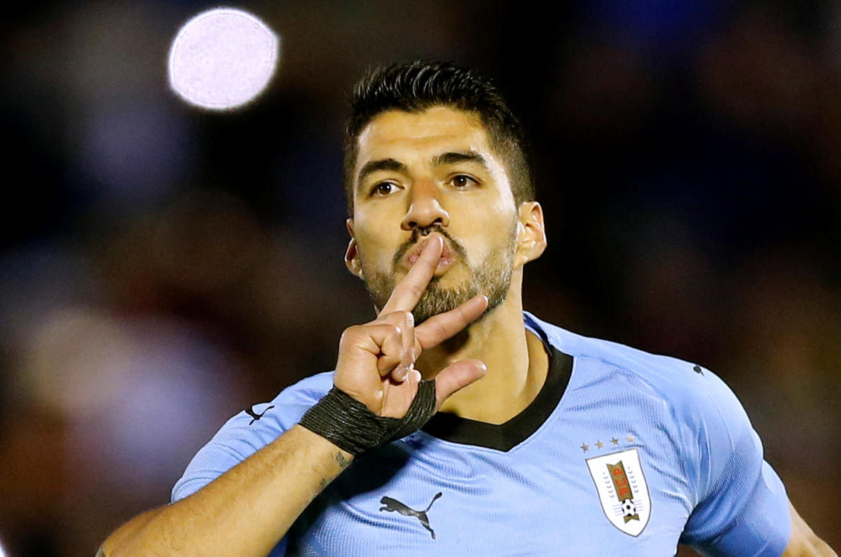 Luis Suarez will reach his century of games for Uruguay against Saudi Arabia on Wednesday. Reuters