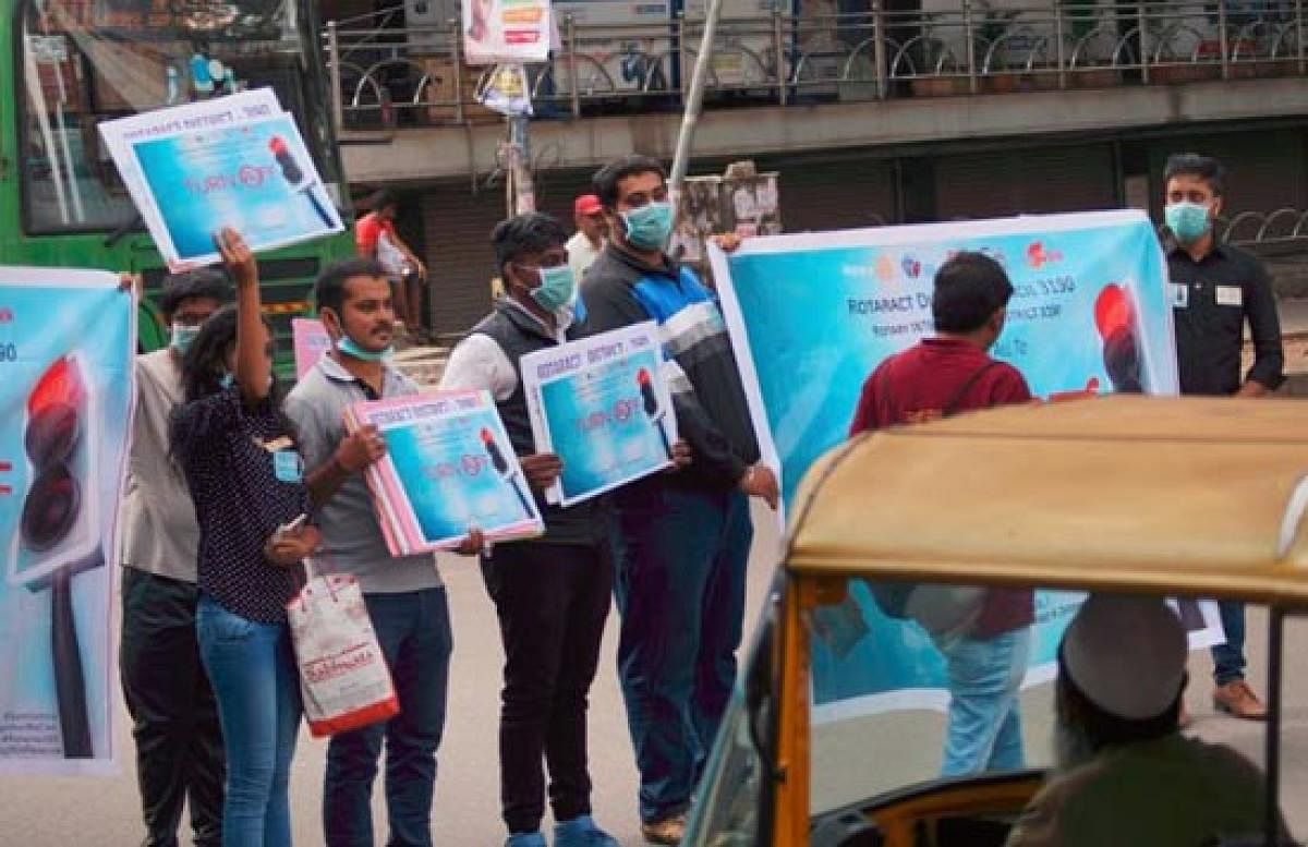 The members of the Rotaract club undertook a unique initiative to create awareness about switching off the vehicle engines at the traffic signal near KFC on CMH Road on Sunday. 