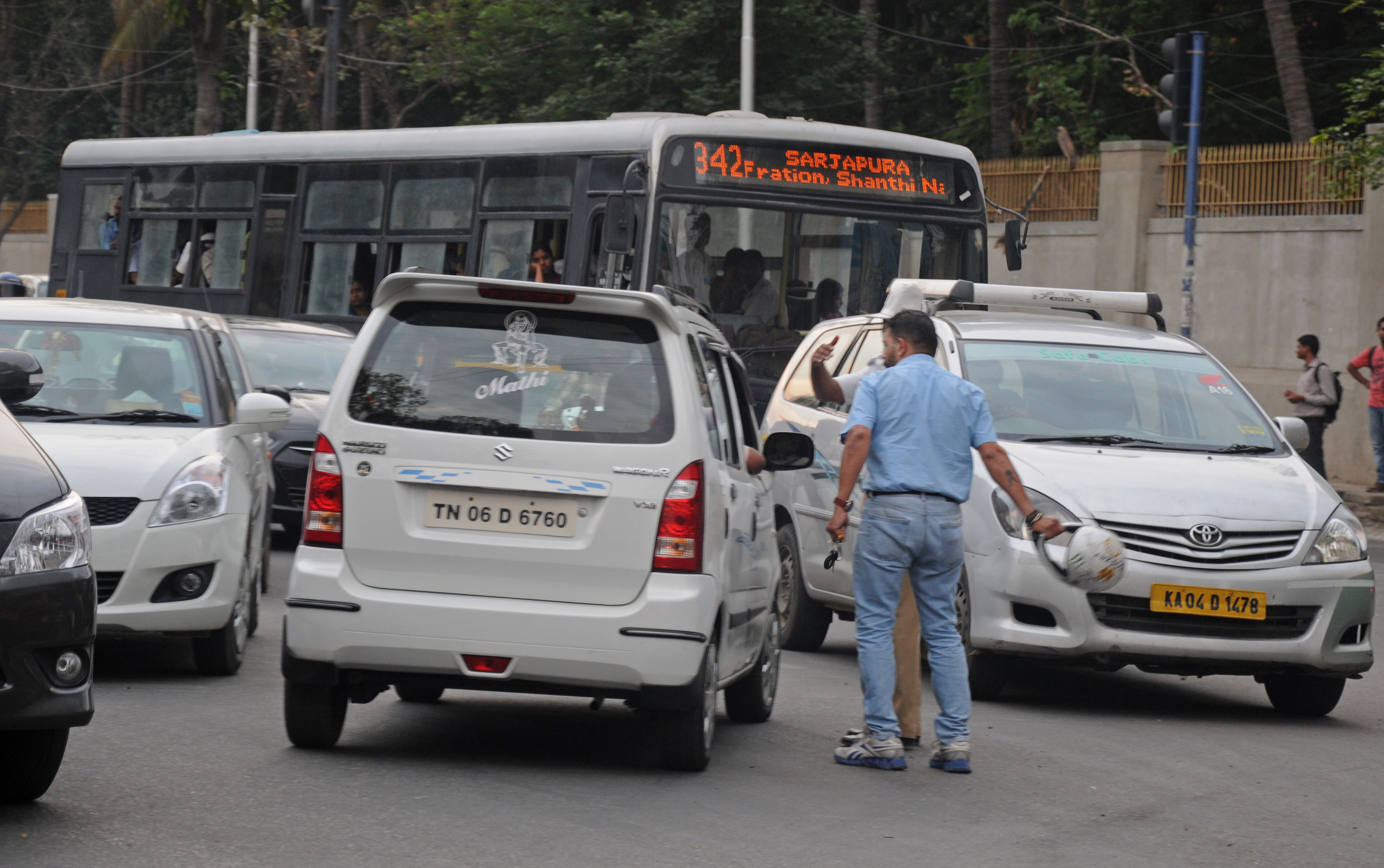 File photo of a furious bike rider threatening to beat up the driver of car in Koramangala. DH PHOTO BY SK DINESH