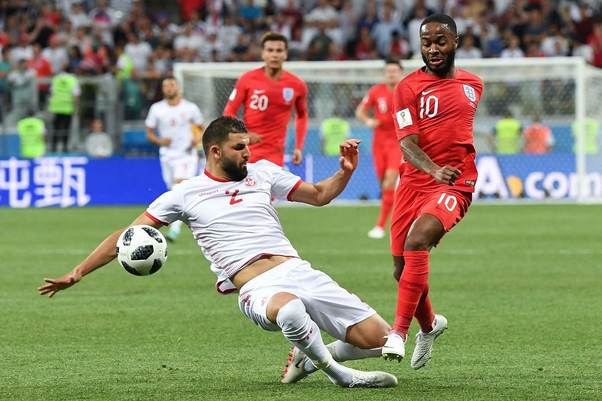 Former England defender Jamie Carragher feels Raheem Sterling (right) doesn't suit England's playing system. AFP  