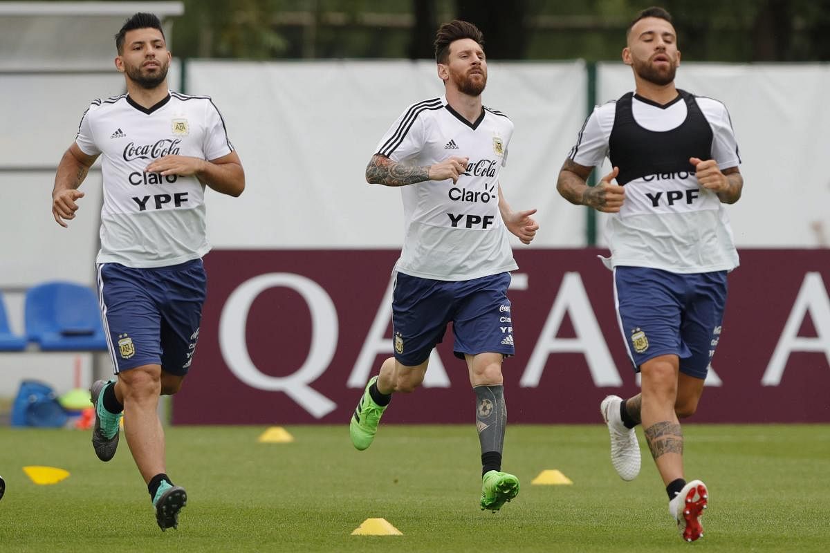 From left to right, Sergio Aguero, Lionel Messi and Nicolas Otamendi jog during a training session of Argentina at the 2018 soccer World Cup in Bronnitsy, Russia on Tuesday. (AP/PTI)