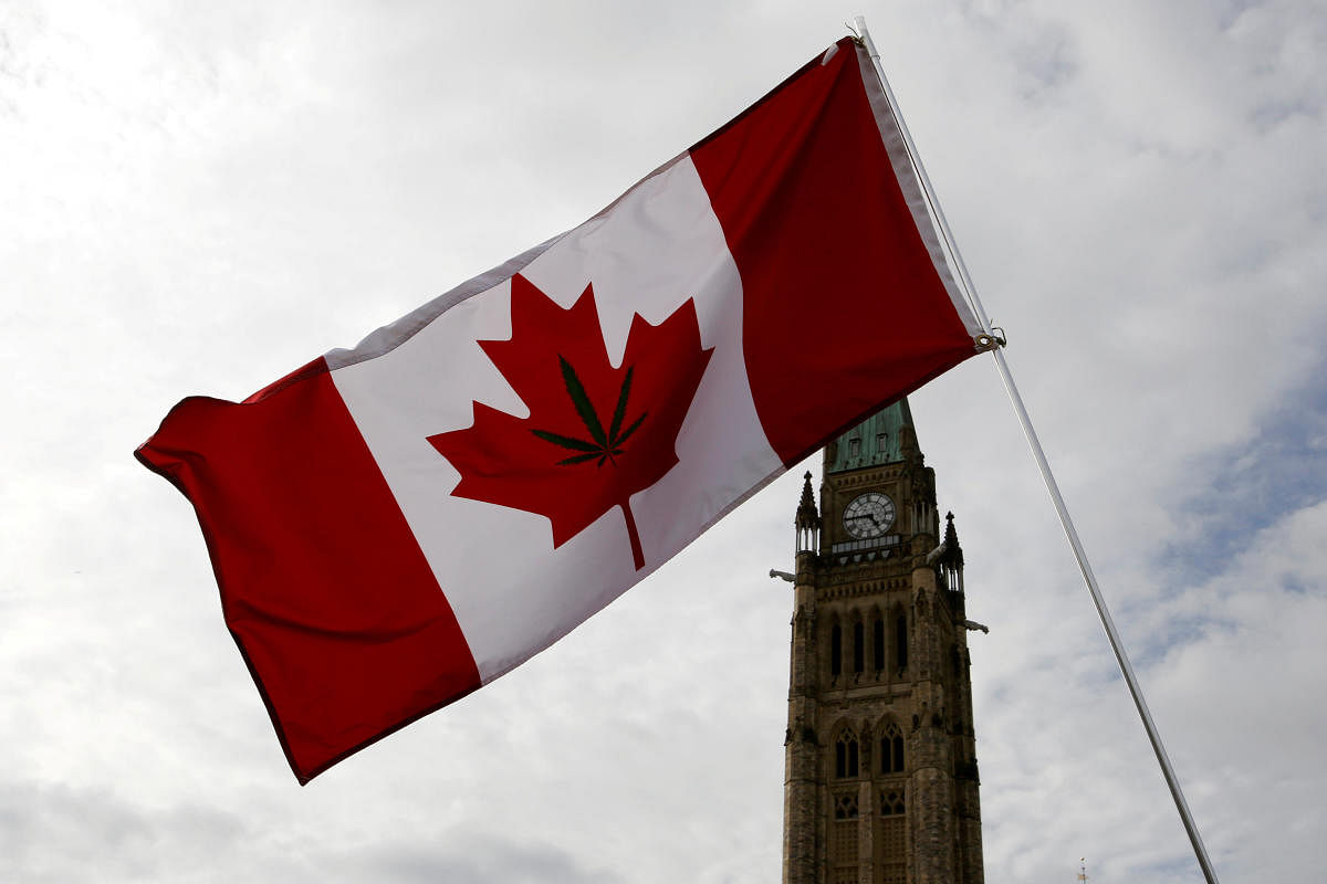 A Canadian flag with a marijuana leaf on it is seen during the annual 4/20 marijuana rally on Parliament Hill in Ottawa in April 2017. (Reuters file photo)