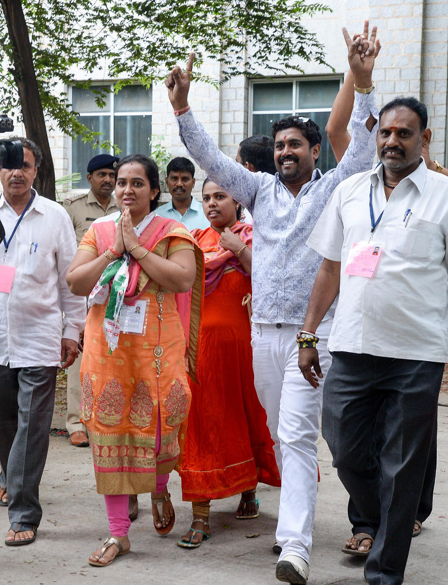 Aishwarya B N, the JD(S) candidate, with her supporters after winning the Binnypet bypoll. dh photo