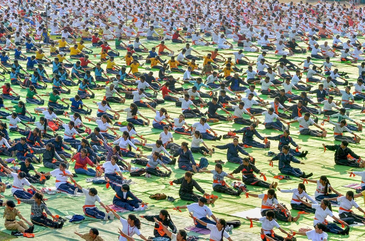Enthusiasts participate in a mass event to mark the 4th International Day of Yoga in Nagpur on Thursday. (PTI File Pic)