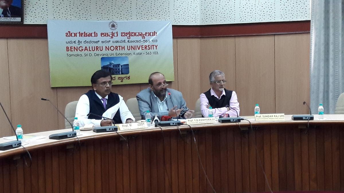 Prof T D Kemparaju (centre), vice-chancellor of Bengaluru North University, addressing the press conference. Prof M S Reddy (right), registrar, and Prof Sundar Raj Urs, registrar (evaluation) are also seen. DH Photo