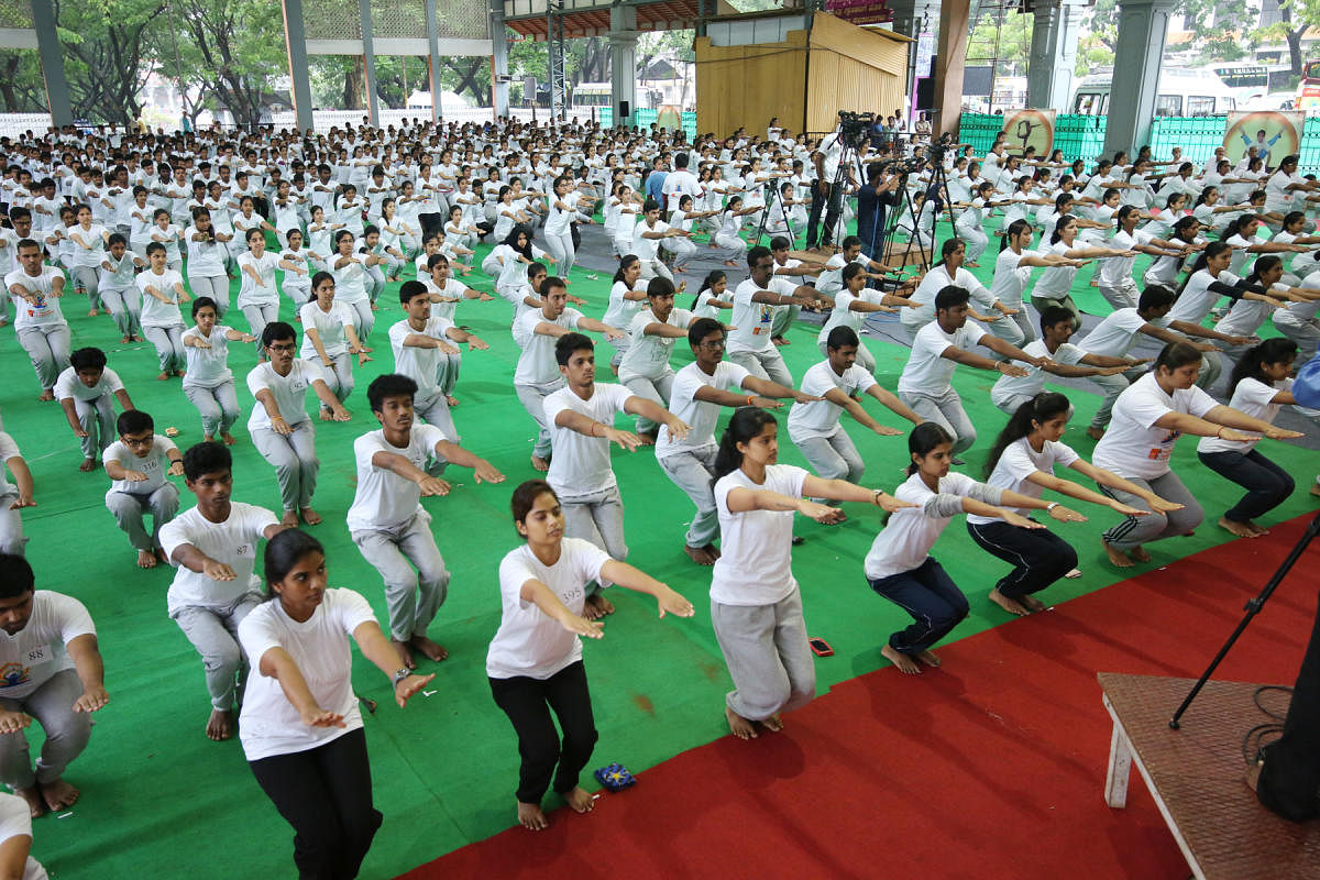 Yoga being performed during International Day of Yoga programme at Dharmasthala on Thursday.
