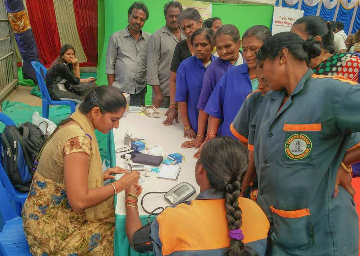 BBMP employees at a health check-up camp at the civic body's headquarters in Bengaluru on Thursday. 