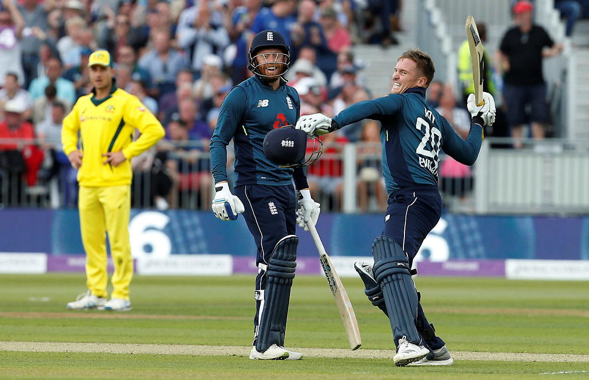 England's Jason Roy celebrates with Jonny Bairstow after reaching a century. (Reuters/Craig Brough)