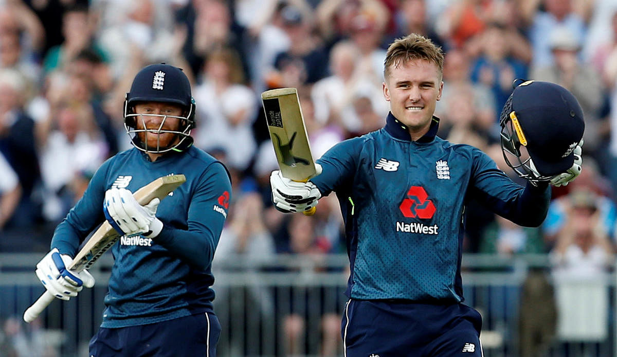 England's Jason Roy (right) celebrates after reaching his hundred against Australia as team-mate Jonny Bairstow looks on. Reuters