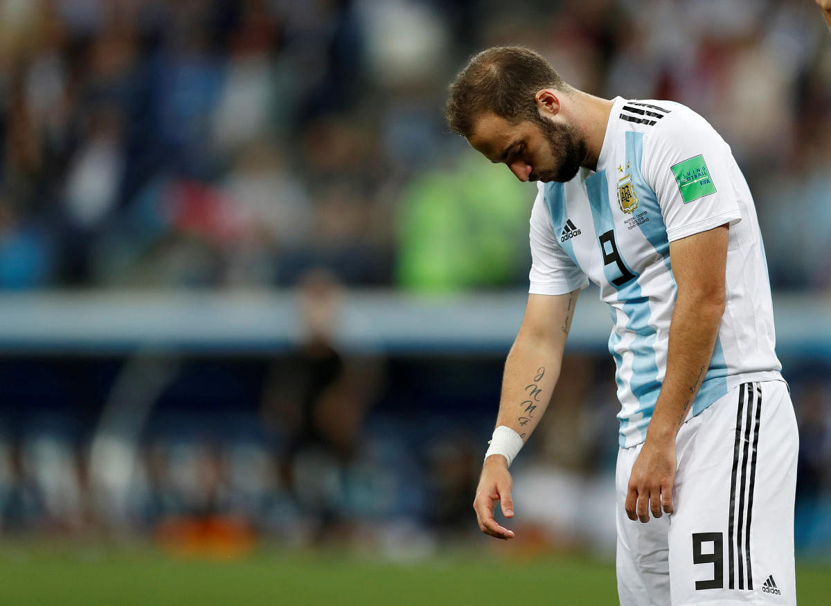 Argentina's Gonzalo Higuain looks dejected after the match. (REUTERS/Matthew Childs)