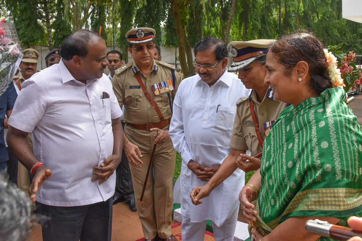 Chief Minister H D Kumaraswamy and Deputy Chief Minister G Parameshwara arrive for a meeting with senior police officers at the state police head quarters in Bengaluru on Friday. (From right) Chief Secretary Ratna Prabha, DG&amp;IGP Neelmani Raju and ADGP