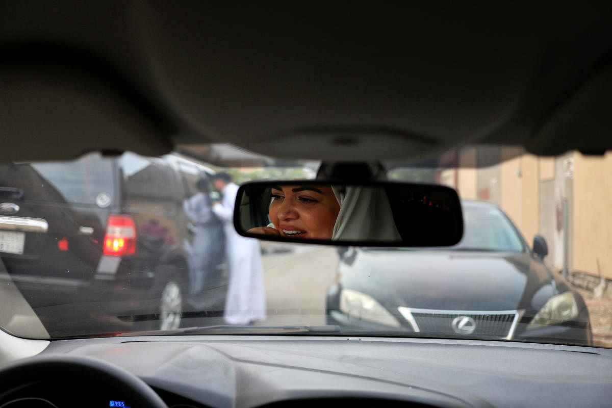 Dr Samira al-Ghamdi, 47, a practising psychologist, drives around the side roads of a neighbourhood as she prepares to hit the road on Sunday as a licensed driver, in Jeddah. Reuters photo
