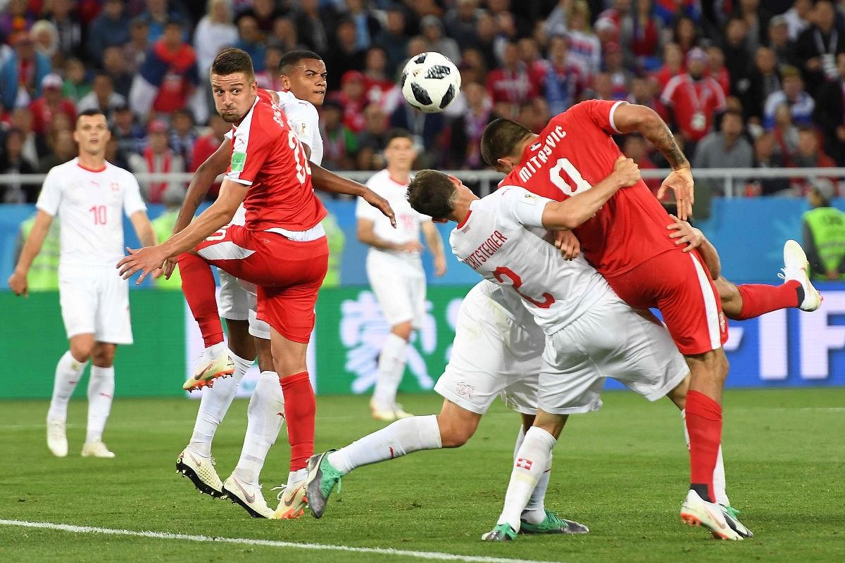  Serbia's forward Aleksandar Mitrovic (right) is held by Switzerland's Stephan Lichtsteiner and Fabian Schar in the penalty area. AFP 