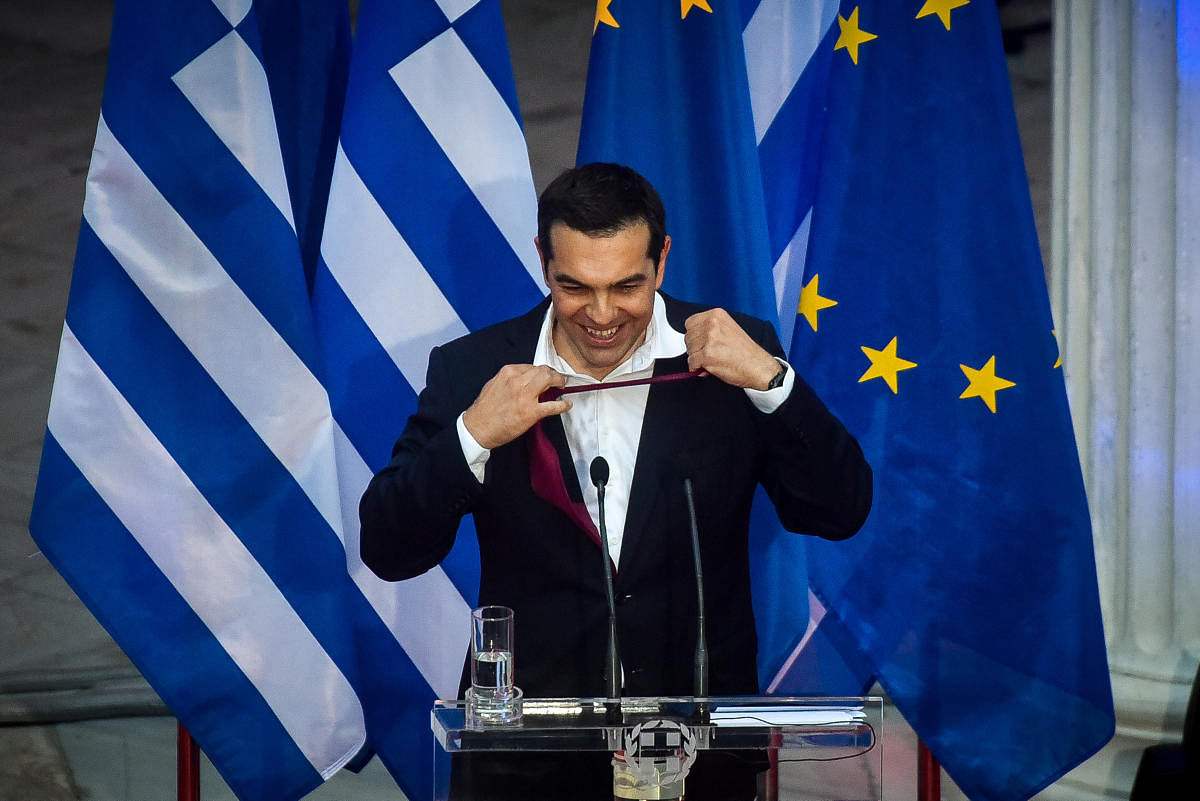 Greek Prime Minister Alexis Tsipras, removes his tie as he speaks at the parliamentary group of Syriza and Independent Greeks in Athens. Reuters photo