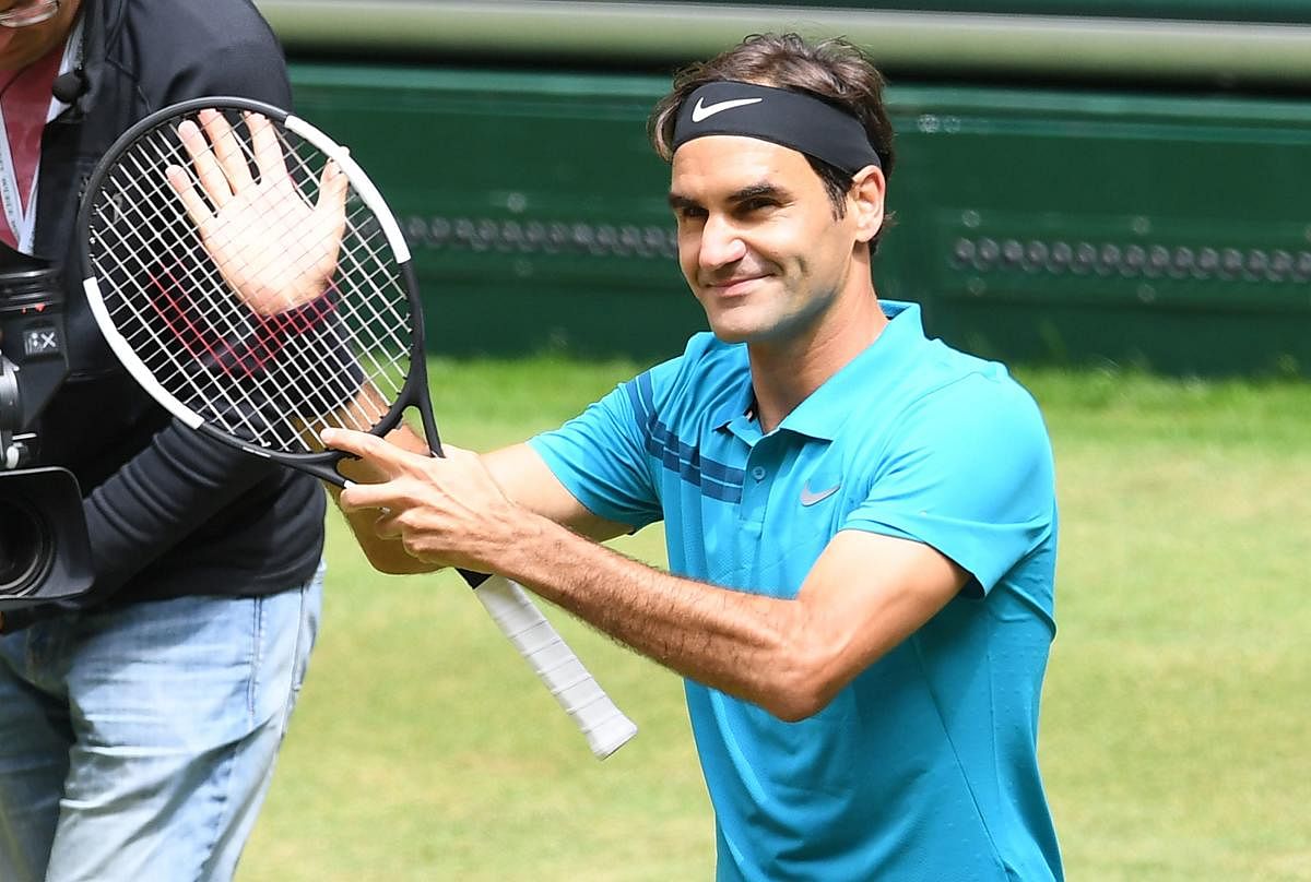 Roger Federer of Switzerland celebrates after defeating US' Denis Kudla in the Halle Open semifinal on Saturday. AFP
