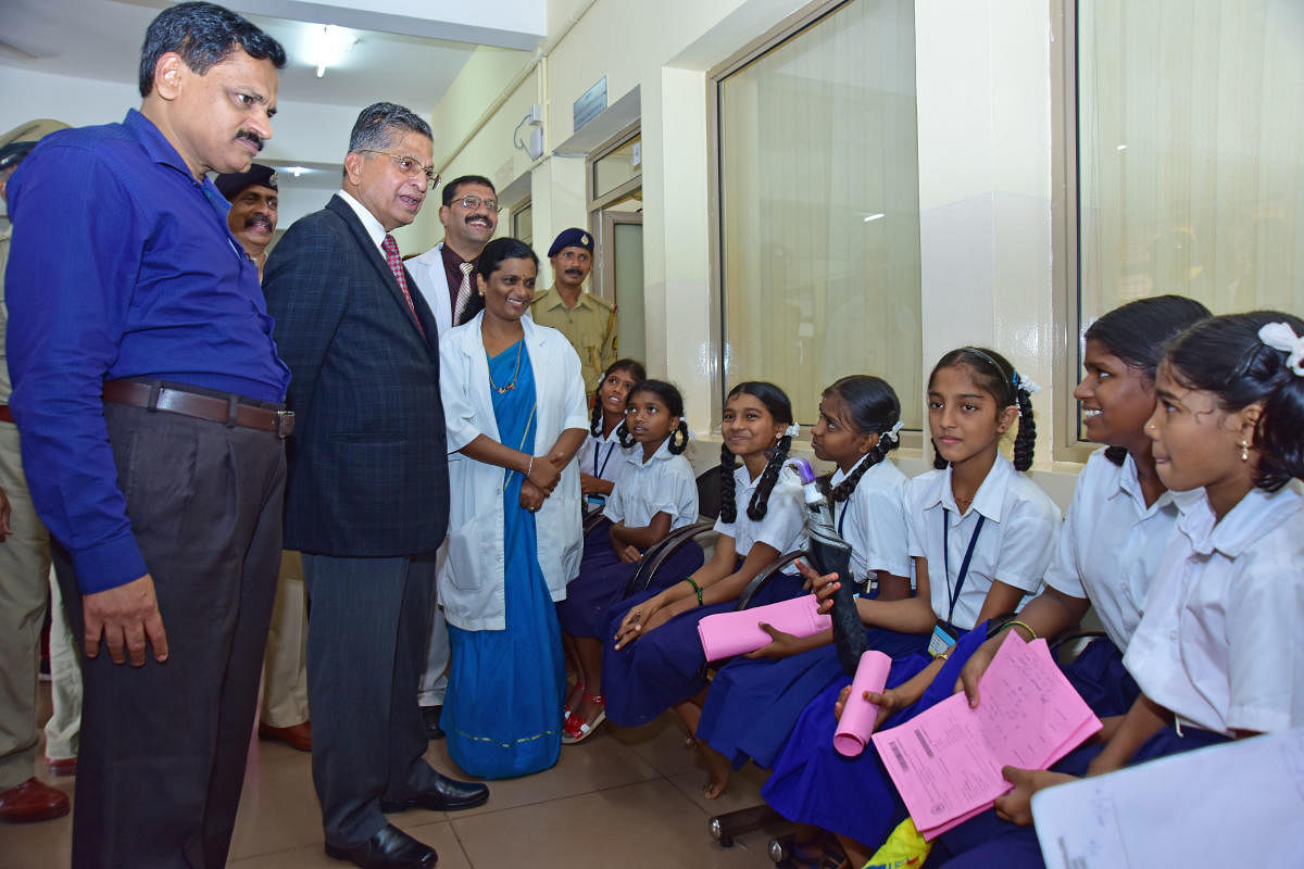 Lokayukta Justice P Vishwanath Shetty speaks to children who had come for treatment at the District Wenlock Hospital in Mangaluru on Friday.