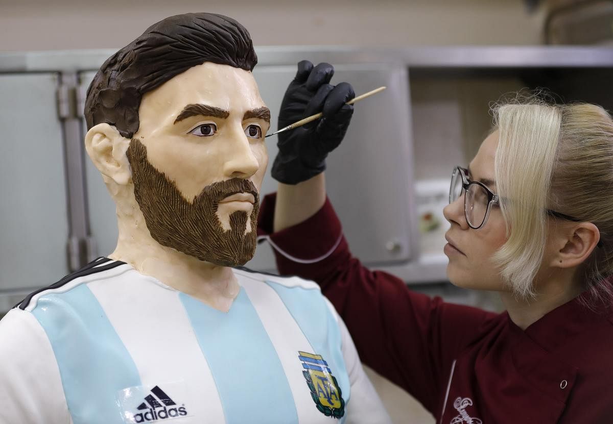 An employee of Altufyevo Confectionery finishes the preparation of a life-size chocolate sculpture of Argentine soccer player Lionel Messi. REUTERS
