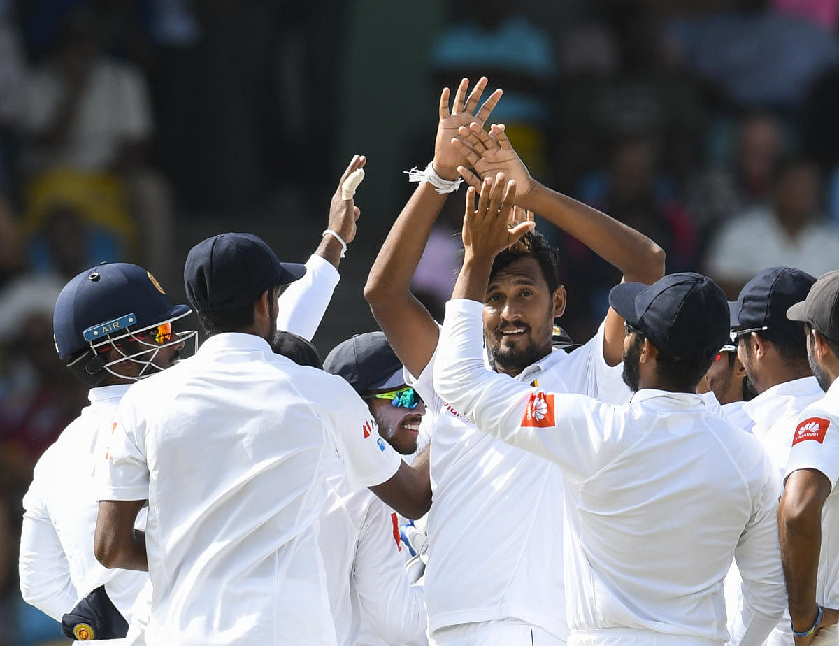 Sri Lanka's stand-in skipper Suranga Lakmal (centre) celebrates with team-mates the dismissal of Devon Smith of West Indies on Saturday. AFP