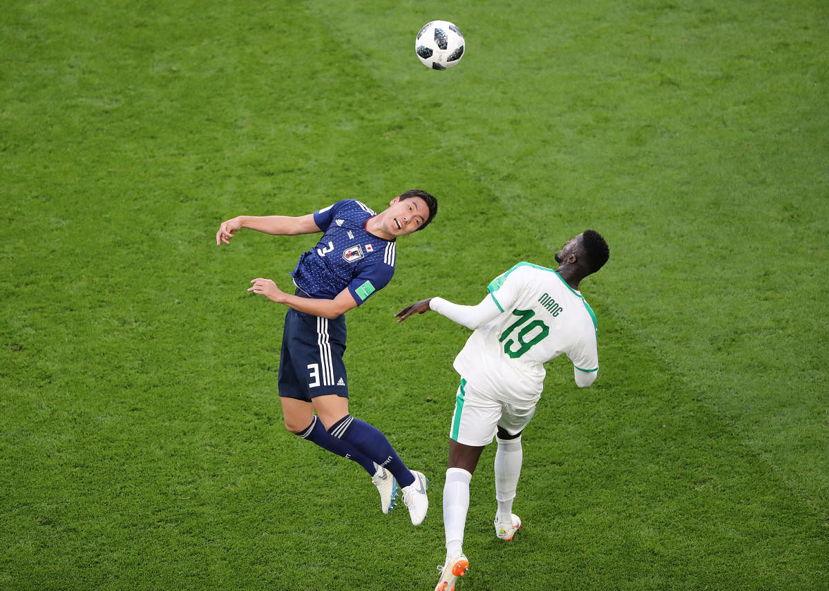 Soccer Football - World Cup - Group H - Japan vs Senegal - Ekaterinburg Arena, Yekaterinburg, Russia - June 24, 2018 Japan's Gen Shoji in action with Senegal's M'Baye Niang REUTERS